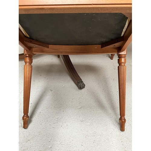 384 - REPRODUCTION REGENCY STYLE MAHOGANY TWIN PEDESTAL DINING TABLE WITH EXTRA LEAF AND 6 MATCHING CHAIRS... 