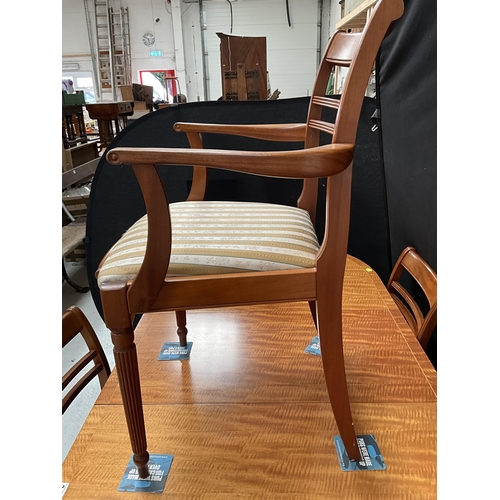 384 - REPRODUCTION REGENCY STYLE MAHOGANY TWIN PEDESTAL DINING TABLE WITH EXTRA LEAF AND 6 MATCHING CHAIRS... 