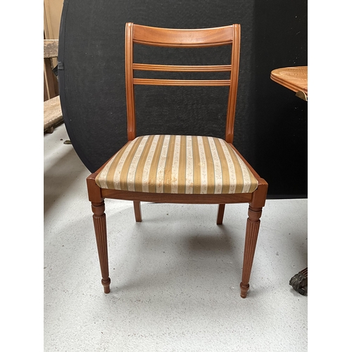 384 - REPRODUCTION REGENCY STYLE MAHOGANY TWIN PEDESTAL DINING TABLE WITH EXTRA LEAF AND 6 MATCHING CHAIRS... 