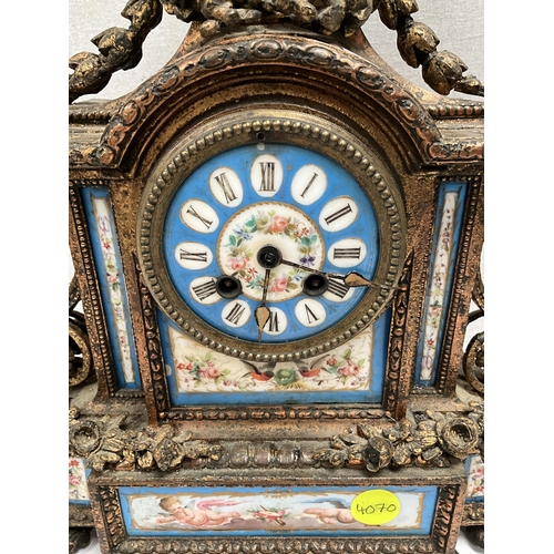 204 - FRENCH GILT METAL MANTEL CLOCK WITH PORCELAIN FACE AND PANELS DECORATED WITH BIRDS FOILAGE CHERUBS E... 