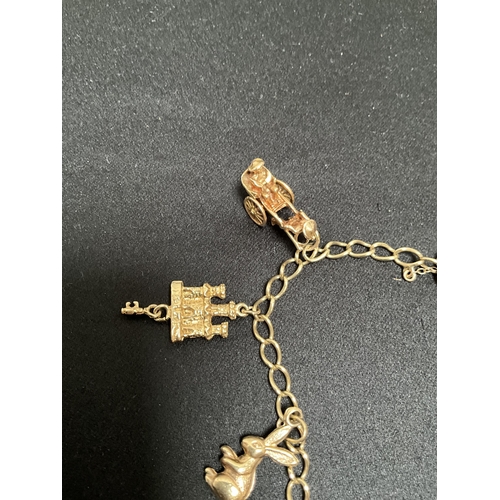 211 - 9CT GOLD CHARM BRACELET - TOTAL WEIGHT 16.5G