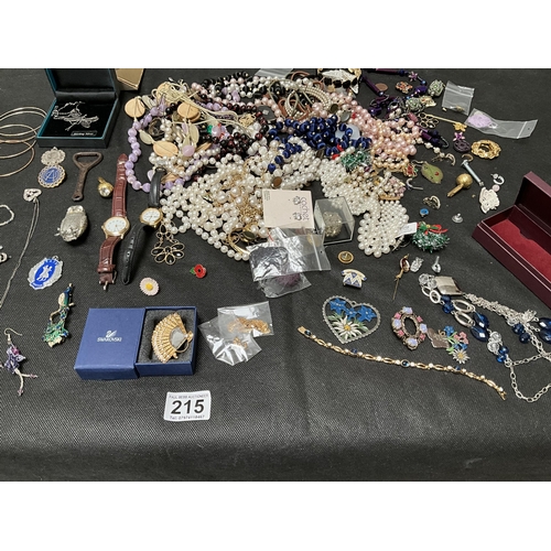 215 - TIN AND TRAY OF COSTUME JEWELLERY ETC TO INCLUDE PAUL PORTINOUX CONVERTIBLE WATCH