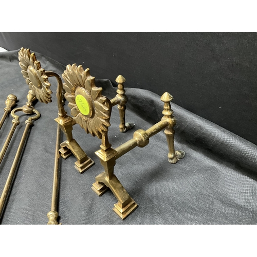 401 - PAIR OF VICTORIAN BRASS FIREDOGS WITH SUNFLOWER DECORATION AND FIRE IRONS