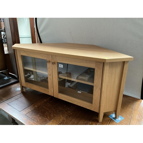 403 - MODERN LIGHT OAK FLAT SCREEN CORNER TV STAND WITH 2 GLAZED DOORS H21