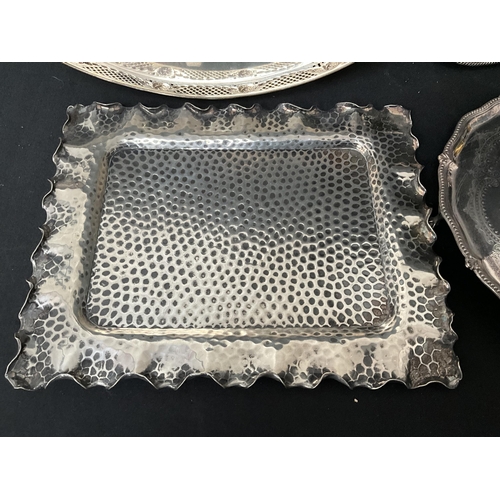 45 - 4 SILVER PLATED SERVING TRAYS TO INCLUDE A HAMMERED DECORATED EXAMPLE