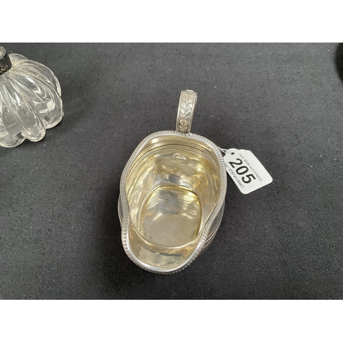 205 - HALLMARK SILVER CREAM JUG, 2 NAPKIN RINGS, COLLARED SCENT BOTTLE 
APPROX TOTAL WEIGHT 155G