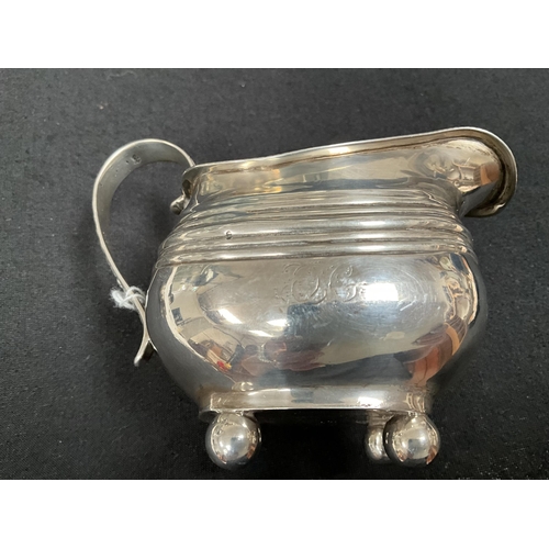 205 - HALLMARK SILVER CREAM JUG, 2 NAPKIN RINGS, COLLARED SCENT BOTTLE 
APPROX TOTAL WEIGHT 155G