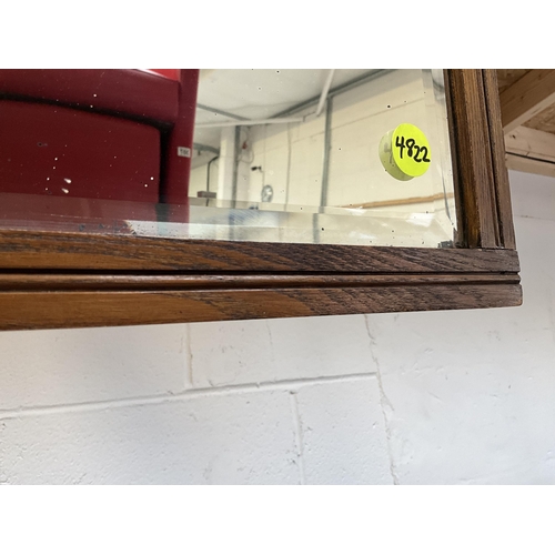 70 - OAK FRAMED BEVEL EDGED WALL MIRROR