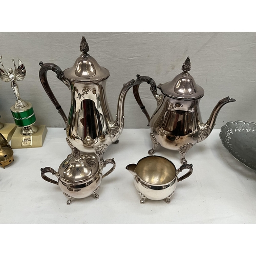 100 - BOX OF SILVER PLATED AND BRASS WARE TO INCLUDE COFFEE SET, BRASS COW BELL ETC