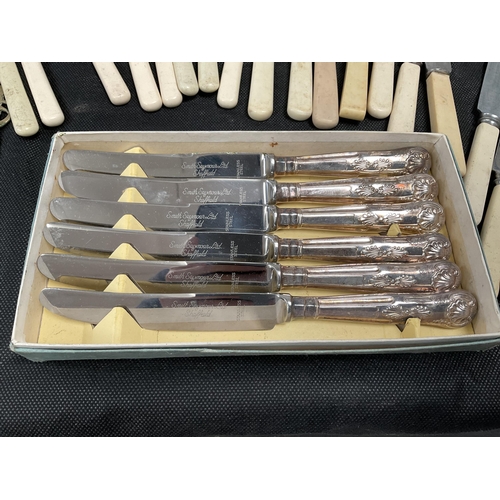 171 - 1 BOX OF VINTAGE CUTLERY TO INCLUDE KNIFES, FORKS SUGAR TONGS, BONE HANDLED BUTTER KNIVES