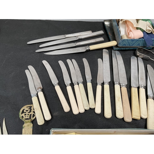 171 - 1 BOX OF VINTAGE CUTLERY TO INCLUDE KNIFES, FORKS SUGAR TONGS, BONE HANDLED BUTTER KNIVES