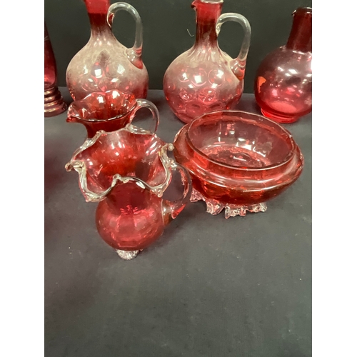 107 - COLLECTION CRANBERRY GLASS TO INCLUDE JUGS, PULPIT VASE - SOME A/F