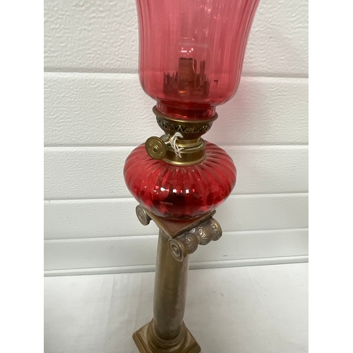 113 - BRASS COLUMN CRANBERRY GLASS OIL LAMP - COMPLETE H25