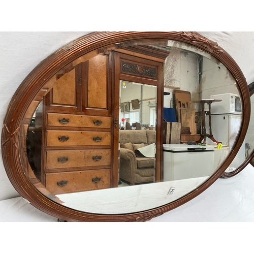 124 - 2 WOODEN FRAMED WALL MIRRORS - LARGEST 37