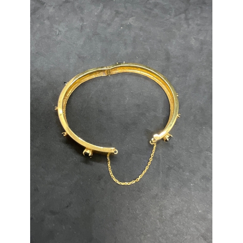 241 - YELLOW METAL BANGLE SET WITH BLUE STONES