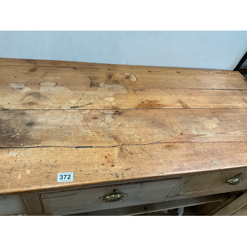 372 - STRIPPED PINE VICTORIAN KITCHEN BASE WITH 4 DRAWERS OVER 2 DOORS H36