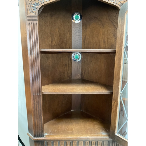 381 - PRIORY OAK CORNER CABINET WITH LEADED GLASS DOOR TO TOP H66