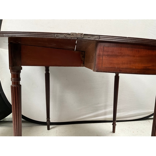 402 - GEORGE III MAHOGANY FOLDING TOPPED TEA TABLE ON REEDED LEGS H28