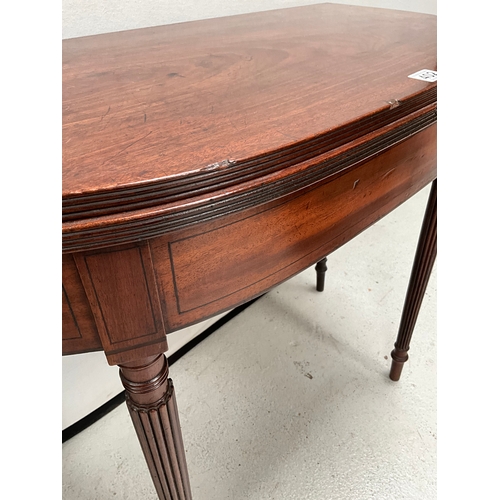 402 - GEORGE III MAHOGANY FOLDING TOPPED TEA TABLE ON REEDED LEGS H28