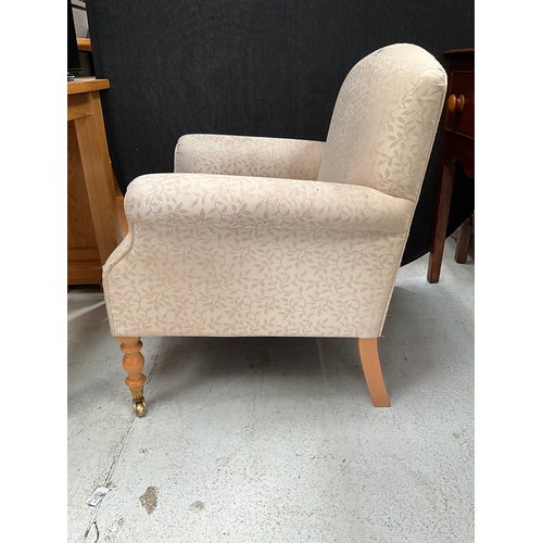 418 - STEWART JONES UPHOLSTERED BEDROOM CHAIR ON TURNED FRONT LEGS WITH BRASS CASTORS A/F TOTAL HEIGHT 34