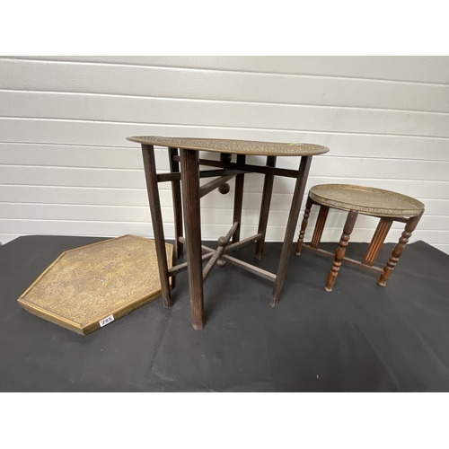 285 - *******lot withdrawn by vendor******2 BRASS TOPPED FOLDING TABLES AND A BRASS PLAQUE H23