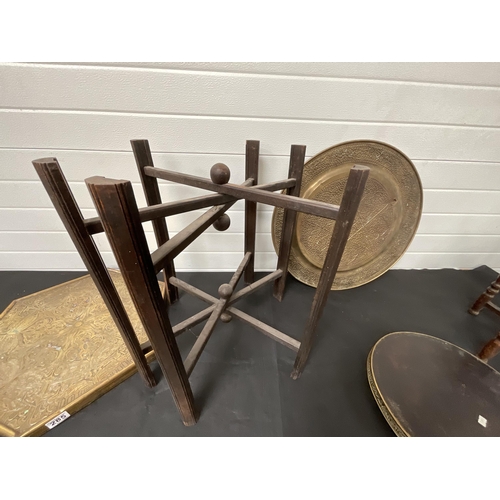 285 - *******lot withdrawn by vendor******2 BRASS TOPPED FOLDING TABLES AND A BRASS PLAQUE H23