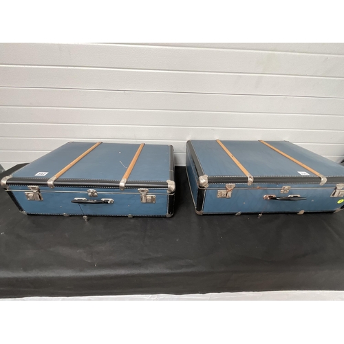 342 - 2 VINTAGE BLUE TRAVELLERS CHESTS 
H10