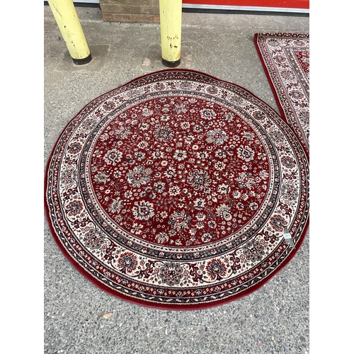 371 - RED PATTERNED CIRCULAR CARPET DIA 67