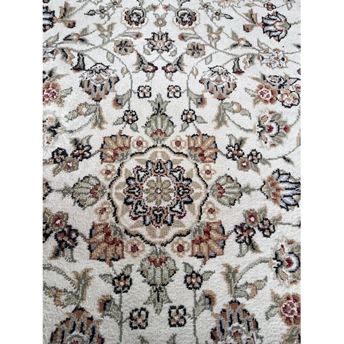 376 - CREAM AND GREEN PATTERNED CARPET 72