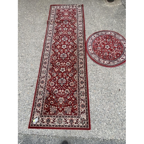 390 - 2 X RED PATTERNED CARPETS 
DIA 31.5