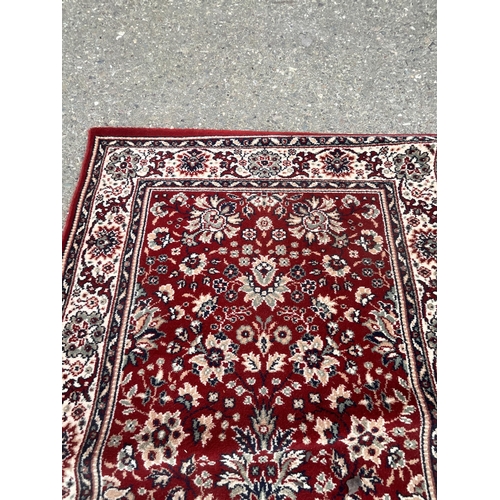 390 - 2 X RED PATTERNED CARPETS 
DIA 31.5