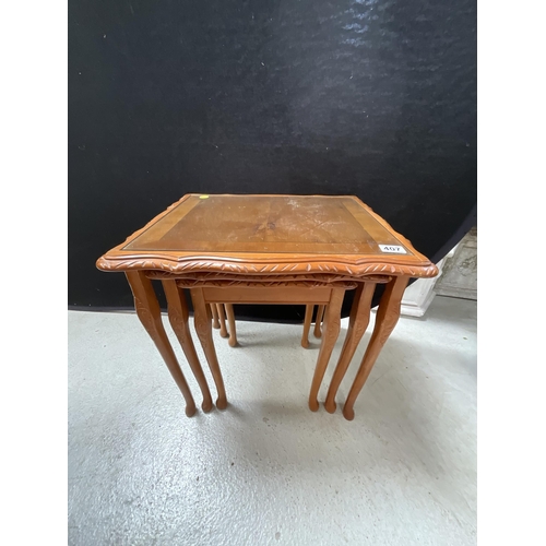 407 - REPRODUCTION YEWWOOD NEST OF 3 TABLES WITH GLASS TOPS H21.5