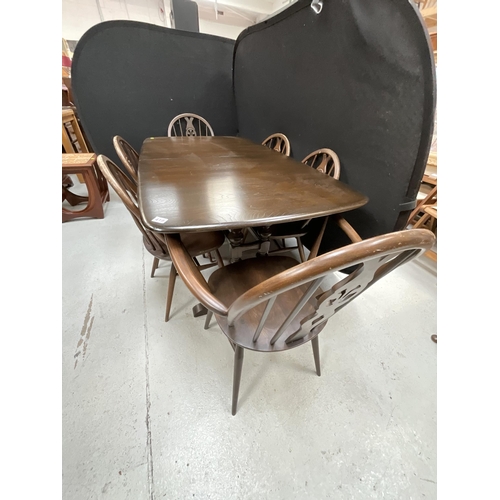 419 - DARK OAK BADGED ERCOL EXTENDING DINING TABLE AND 6 MATCHING CHAIRS INCLUDING 2 CARVERS H29