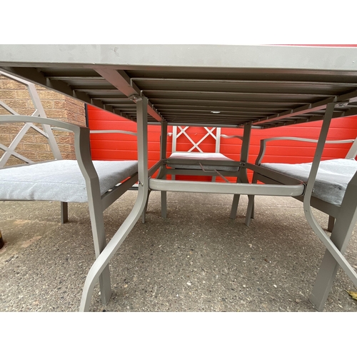 428 - METAL GARDEN TABLE AND 4 MATCHING CHAIRS COMPLETE WITH CUSHIONS H28