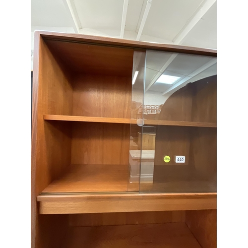 440 - BADGED G PLAN TEAK WALL CABINET WITH GLASS SLIDING DOORS TO TOP OPEN SHELVES BELOW AND 3 DRAWERS TO ... 