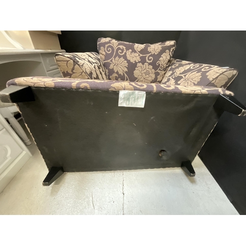 459 - MODERN UPHOLSTERED PURPLE PATTERNED ARM CHAIR AND MATCHING FOOT STOOL