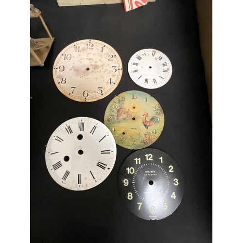 117 - BOX OF CLOCK WORKS BEZELS ETC