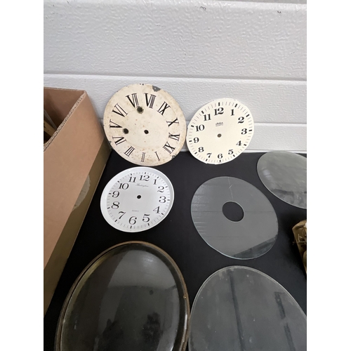 117 - BOX OF CLOCK WORKS BEZELS ETC