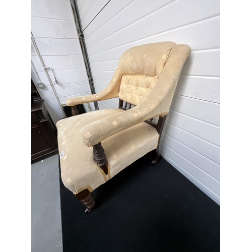 257 - GOLD UPHOLSTERED BEDROOM ARMCHAIR ON ORIGINAL BRASS CASTORS