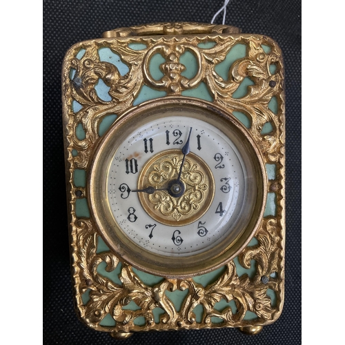 209 - VINTAGE GREEN BAKELITE CASED CLOCK DECORATED WITH BRASS FRETWORK AND CARRYING HANDLE H4