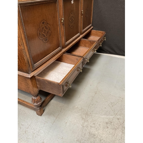 328 - VINTAGE OAK SIDEBOARD WITH 3 DOORS TO TOP OVER 3 DRAWERS TO BASE ON STRETCHERED LEGS H38