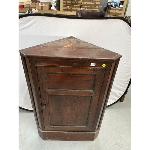 354 - GEORGIAN OAK FLOOR STANDING CORNER CUPBOARD WITH 2 PANELS TO DOOR (WOOD WORM TO BACK) H49