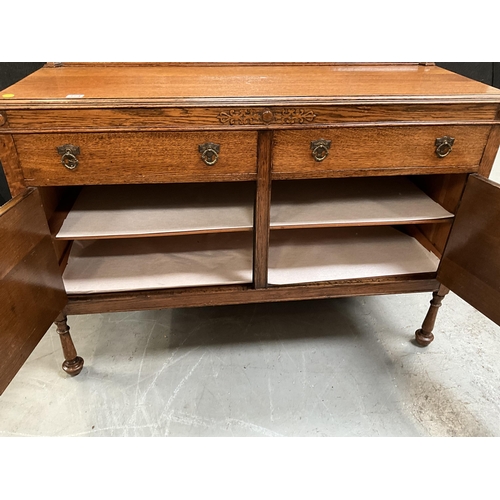 374 - VINTAGE OAK MIRROR BACKED SIDEBOARD WITH CENTRAL MIRROR TO BACK AND 2 DRAWERS OVER 2 DOORS ON TURNED... 