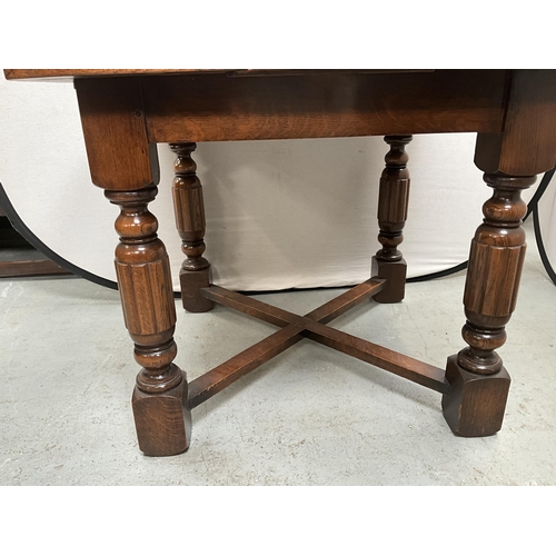 380 - VINTAGE OAK DRAWER LEAF DINING TABLE ON 4 REEDED LEGS WITH STRETCHERED BASE H30