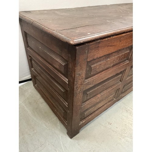 388 - EARLY GEORGIAN DARK OAK WELSH COFFER WITH 9 PANEL DECORATION TO FRONT A/F H28