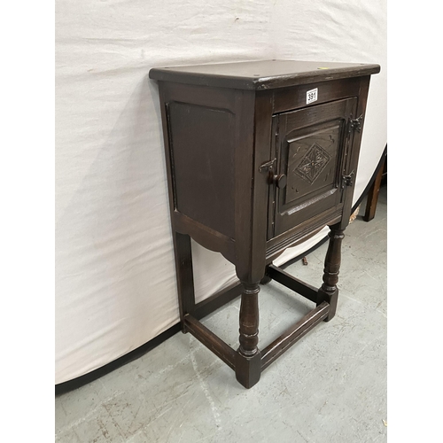 391 - DARK OAK PRIORY STYLE POT CUPBOARD WITH SINGLE DOOR WITH CARVED PANEL ON TURNED AND STRETCHERED BASE... 