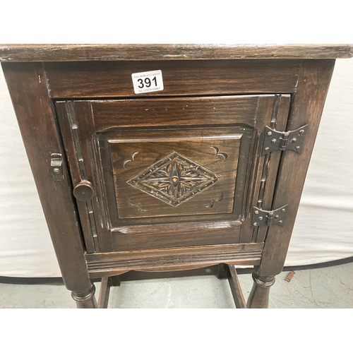 391 - DARK OAK PRIORY STYLE POT CUPBOARD WITH SINGLE DOOR WITH CARVED PANEL ON TURNED AND STRETCHERED BASE... 