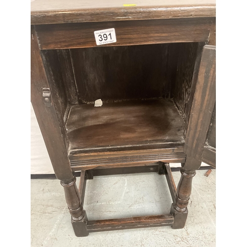 391 - DARK OAK PRIORY STYLE POT CUPBOARD WITH SINGLE DOOR WITH CARVED PANEL ON TURNED AND STRETCHERED BASE... 