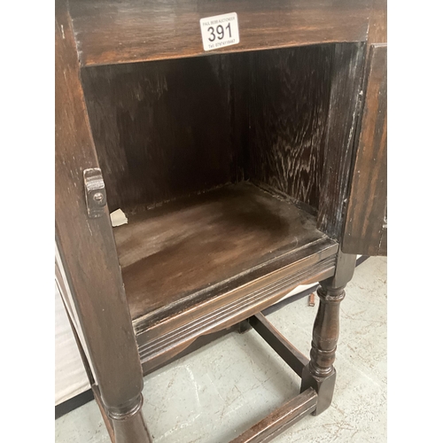 391 - DARK OAK PRIORY STYLE POT CUPBOARD WITH SINGLE DOOR WITH CARVED PANEL ON TURNED AND STRETCHERED BASE... 