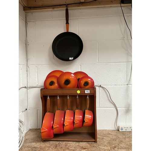 11 - FRENCH CAST IRON LE CREUSET PAN SET COMPLETE WITH LIDS, STAND AND FRYING PAN